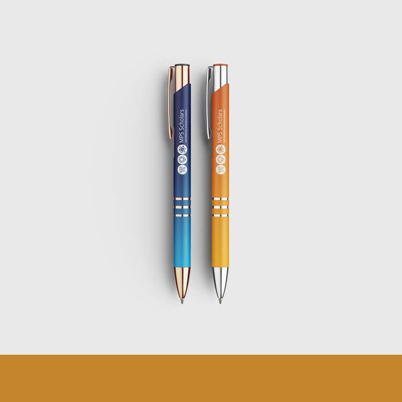 MPS Scholars logo designed by Noelle Nuñez logo on two pens one blue one orange